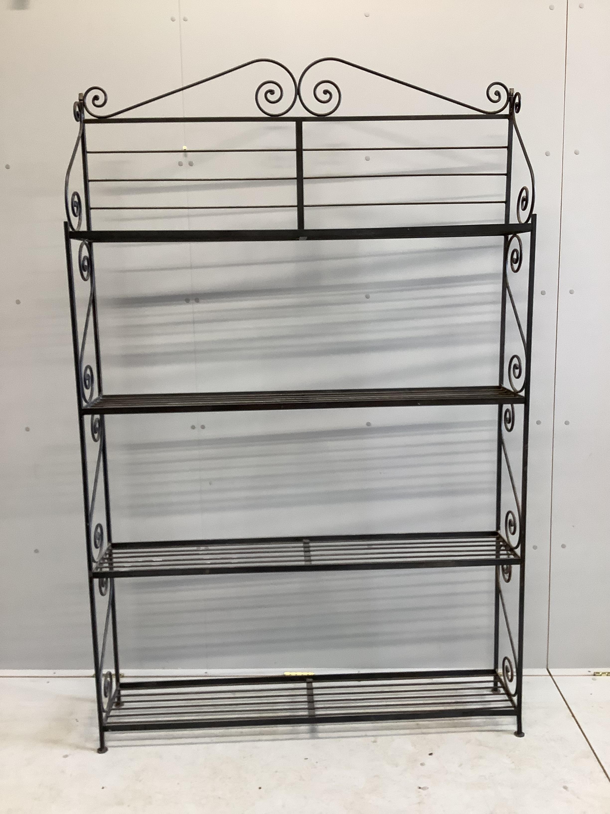 A wrought iron four tier baker's stand, width 127cm, depth 25cm, height 195cm